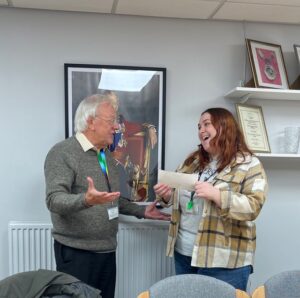 Cllr Bob Kelly presenting cheque to charity